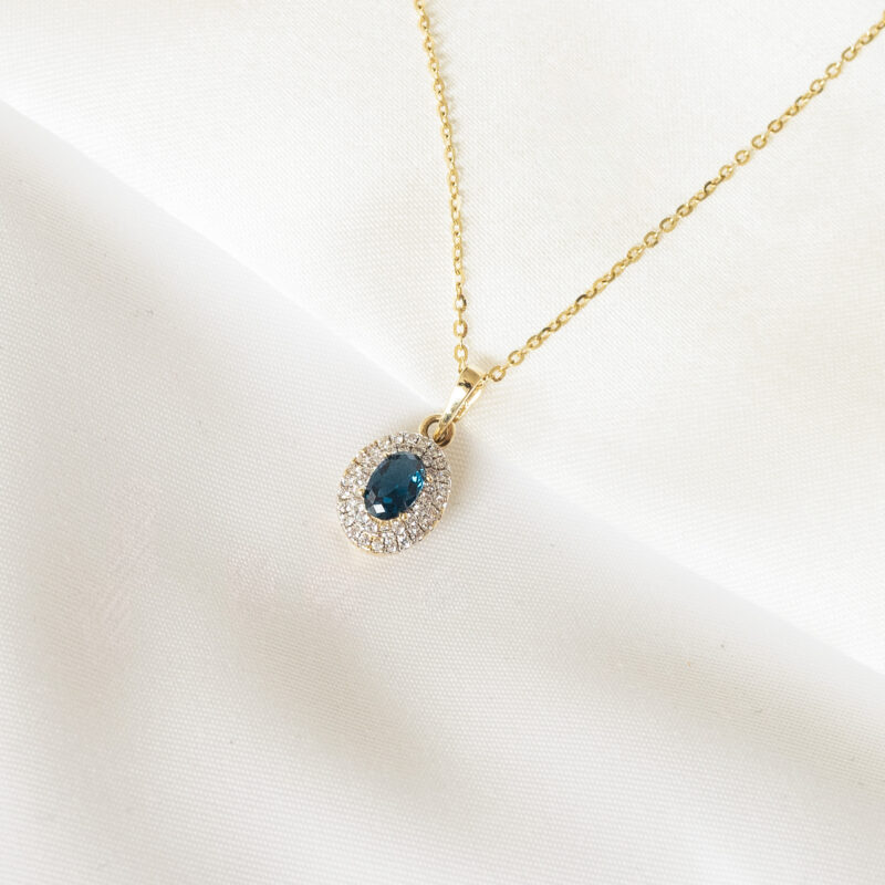 Zawieszka złota z granatowym kamieniem i cyrkoniami