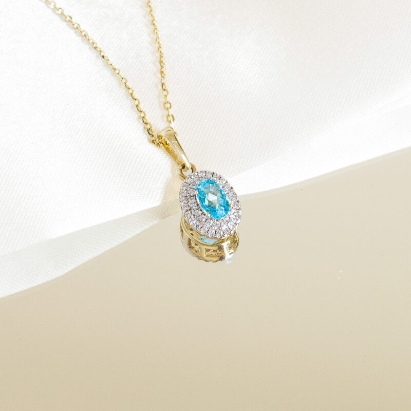Zawieszka złota z błękitnym kamieniem i cyrkoniami