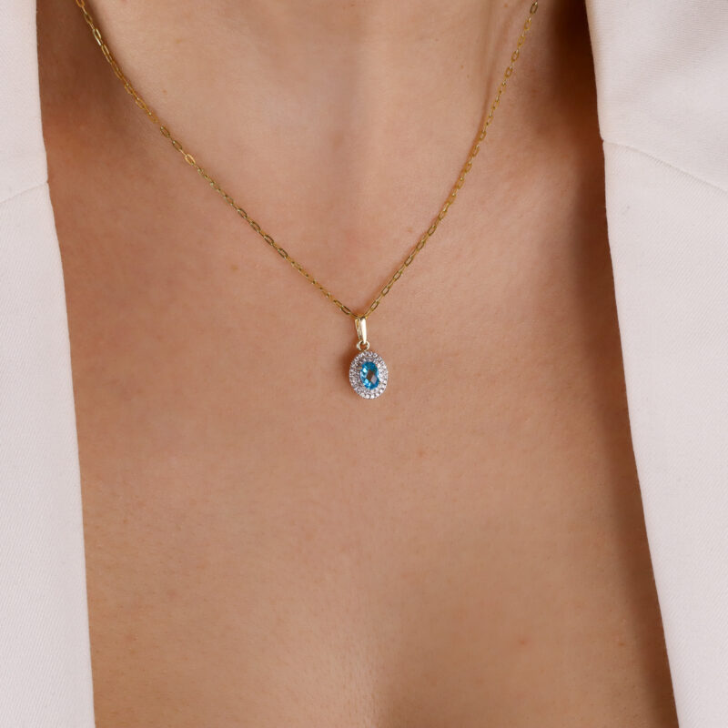 Zawieszka złota z błękitnym kamieniem i cyrkoniami
