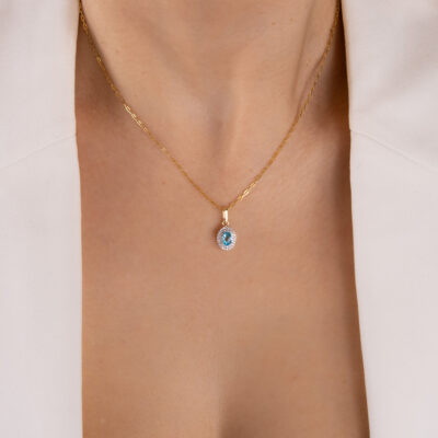 Zawieszka złota z błękitnym kamieniem i cyrkoniami