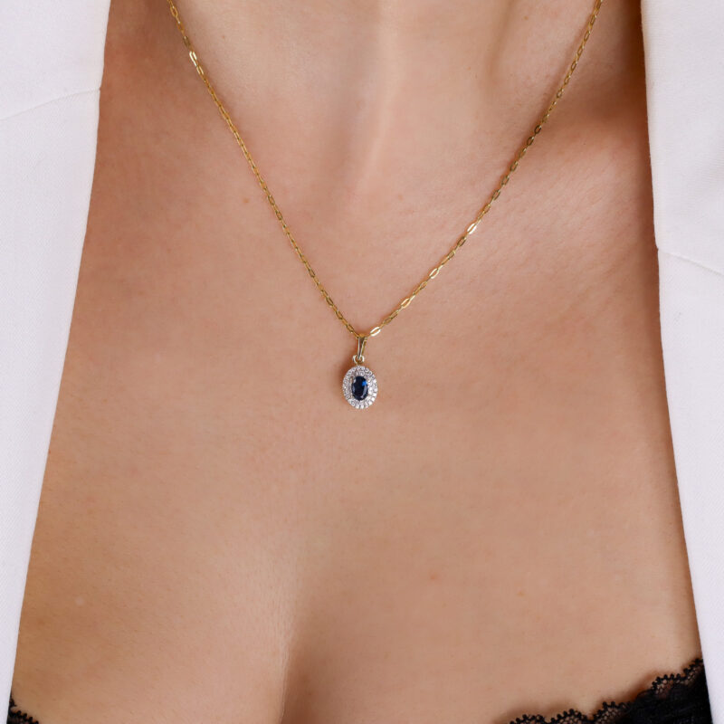 Zawieszka złota z granatowym kamieniem i cyrkoniami